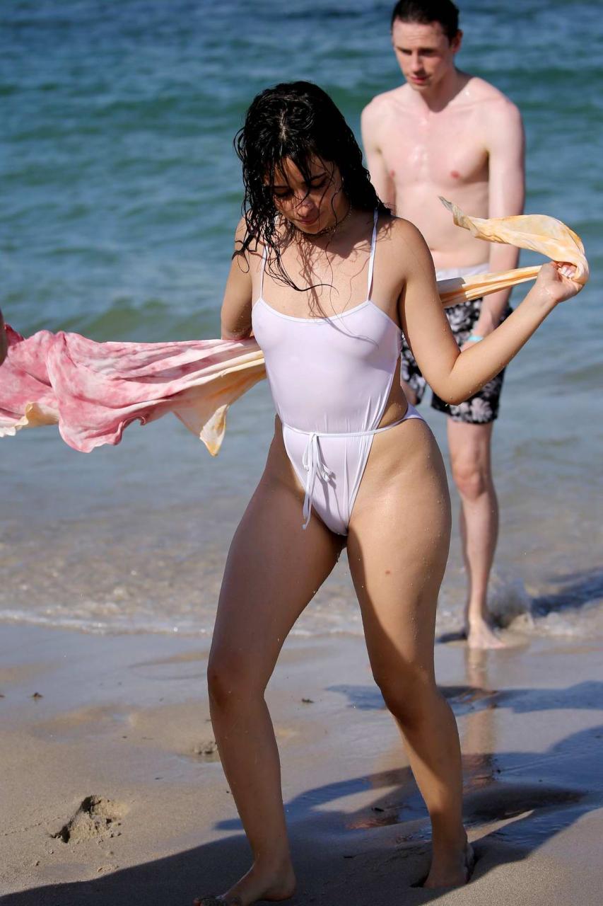 camila cabello wears a white swimsuit during a pda-filled beach day with shawn mendes in miami, florida-290719_25