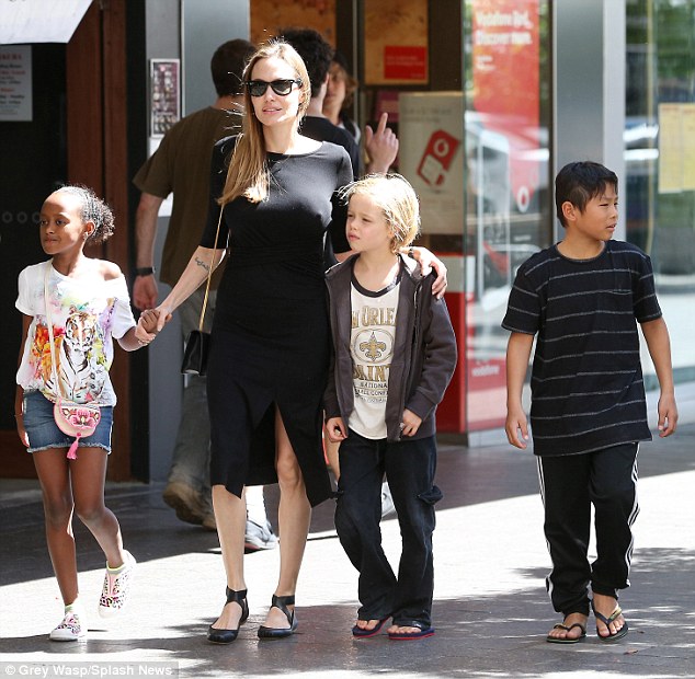 Family affair: Angelina Jolie take three of her children - Shiloh, Zahara and Pax - to a surfshop in Sydney.