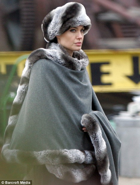 Angelina Jolie wears a fur hat on the set of her new movie Salt in Staten Island