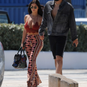 Radiating goddess vibes! Demi Rose stuns in a bold top and silky trousers while enjoying a stroll with her boyfriend in Ibiza.