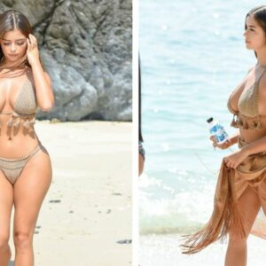 Demi Rose embracing her natural beauty in a stunning beige twopiece, soaking up the sun and ocean vibes on the picturesque shores of Phuket.