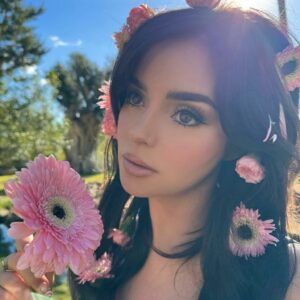 Step into the captivating world of Demi Rose in her very own rose garden.