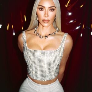 Kim Kardashian stuns in Marc Jacobs’ Resort Collection campaign, showcasing her iconic curves with a touch of blonde bombshell beauty.