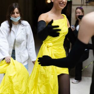 Dua Lipa stuns in a oneshoulder yellow mini at Balenciaga couture, radiating sophistication and grace. A vision of elegance for the season ahead.