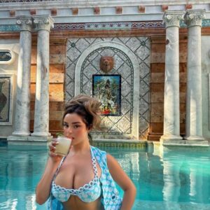 Demi Rose turning heads in a captivating blue swimsuit at the pool! Her fearless fashion sense has us all obsessed with her bold style choices.