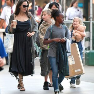 Angelina Jolie and daughter Shiloh redefine motherdaughter goals with their stylish outing. Elegance meets skater chic at the toy store!