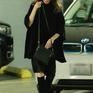 Angelina Jolie keeps it casual and humble as she greets fans in an oversized black sweater during a laidback movie outing. True star power!