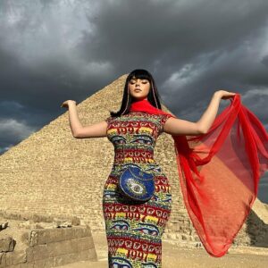 Demi Rose exhibits her curves in a colourful skinтιԍнт maxi dress as she poses in front of the pyramids in Egypt