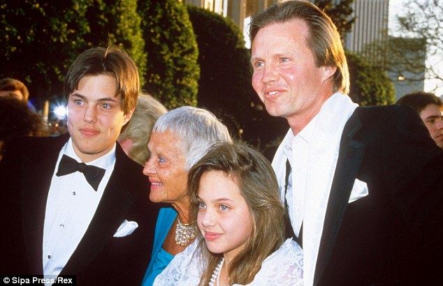 Ambitious girl: Pictured with her brother (left) and grandmother (second from left) in 1986, 10-year-old Angelina wanted to act, just like her father Jon Voight, right