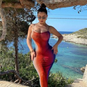 Demi Rose is attractive in a rainbow-colored dress vs