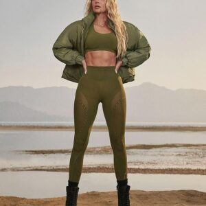 Khloe Kardashian slays in her new Fabletics drop, flaunting killer abs in an olive green set that screams confidence and strength.