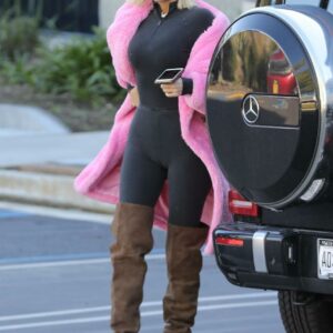 Stunning in pink! Khloe Kardashian spotted rocking a fabulous fur coat while out and about in Calabasas. Fashion game on point as always!