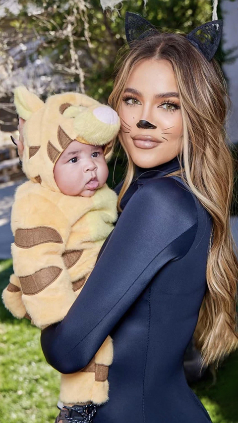 The Kardashians star showed her young son in an adorable plush Tigger costume as she wore a skinтιԍнт black catsuit to celebrate his first Halloween