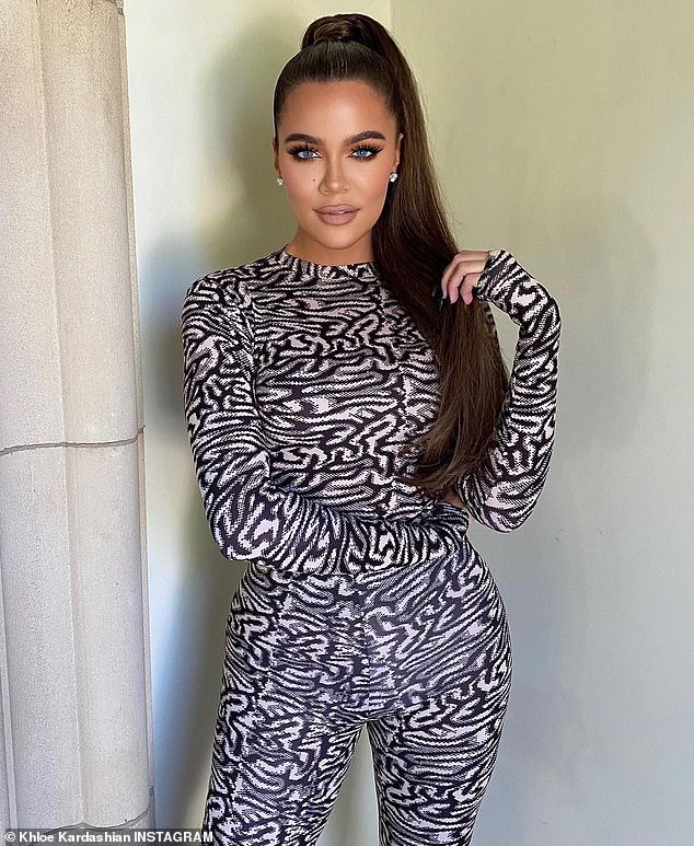 Svelte and stylish: Khloe Kardashian posted several new pinup pH๏τos to her Instagram page on Thursday where she was modeling a black-and-white catsuit from her company Good American