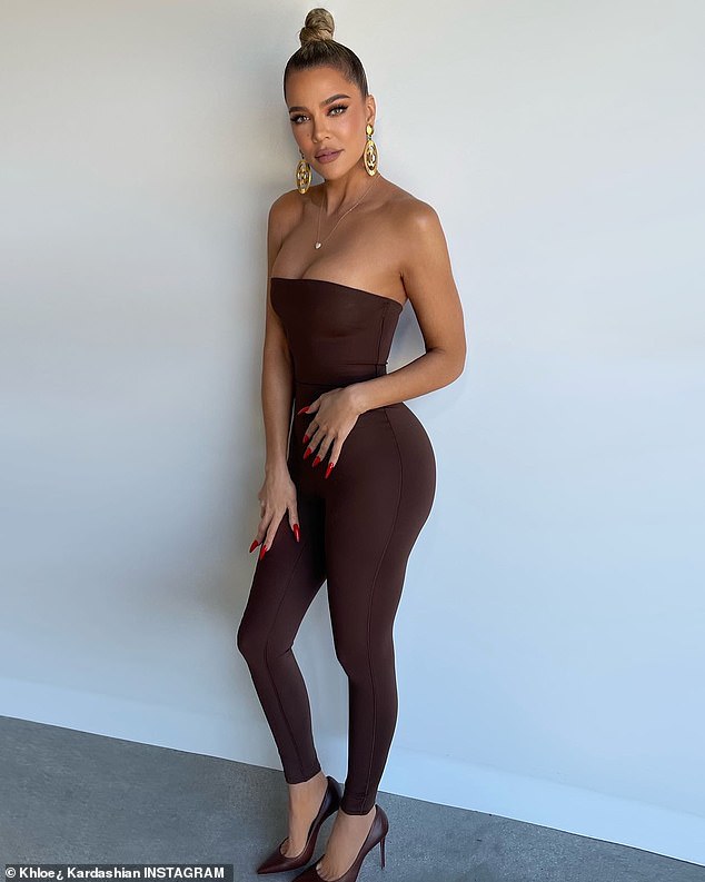 Wow factor: Khloe Kardashian flaunted her fitter figure as she shared a snap On Instagram Tuesday of herself in a clinging outfit from her sister Kim's SKIMS range