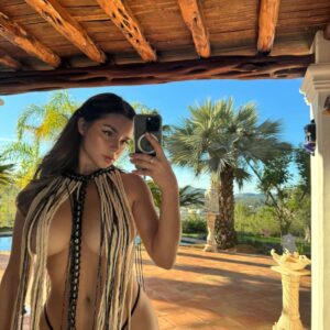 Demi Rose leaves very little to the imagination in skimpy fringed beachwear and a tiny thong as she poses for racy snaps in Ibiza