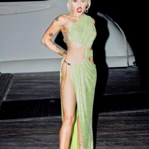 Miley Cyrus turns heads in a daring look, rocking only Gucci kicks for a statement that screams high fashion confidence.