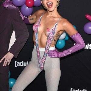 Miley Cyrus brings bold style to the Adult Swim Upfront event with ʙuттerfly pasties and a monokini, proving fearless fashion knows no bounds.